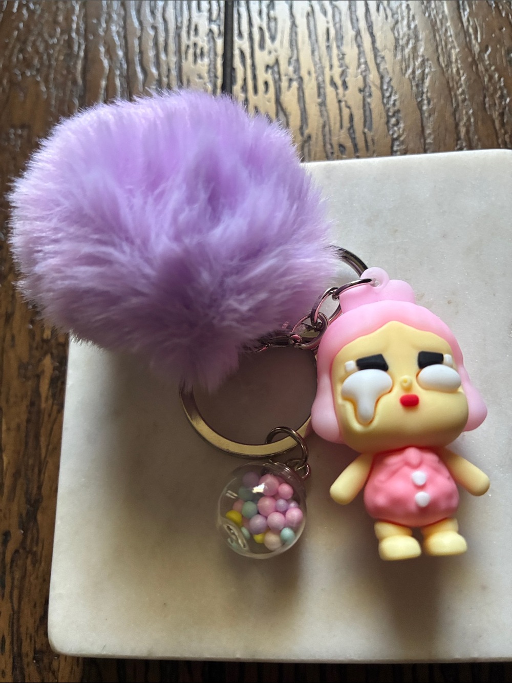 Cute Purple Pom Pom Keychain with Pink Crying Doll